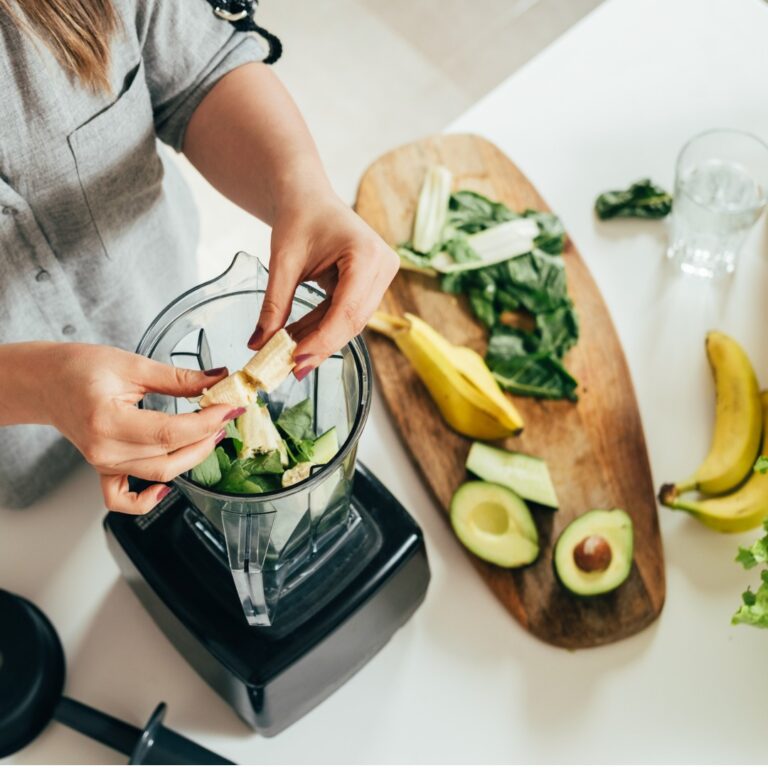 woman-is-preparing-a-healthy-detox-drink-in-a-blender-a-green-smoothie-with-fresh-fruits